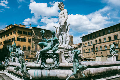 Low angle view of statue in front of building