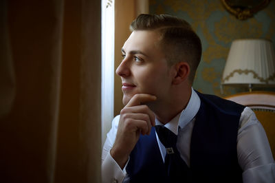 Close-up of young man at home