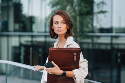 Young woman holding book