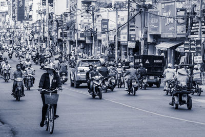 People riding bicycle on city street