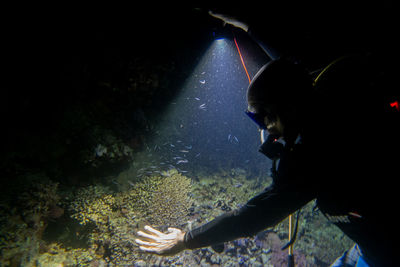 Side view of man swimming in sea
