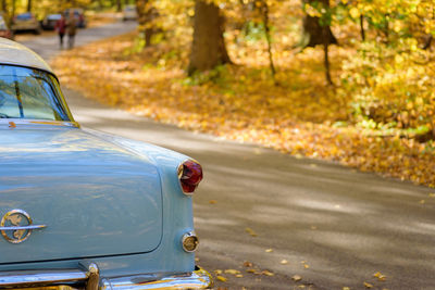 Close-up of car on road