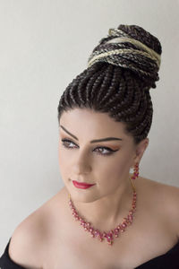 Portrait of a beautiful young woman over white background