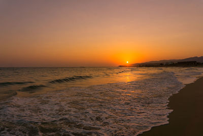 Scenic view of sea against clear sky during sunset