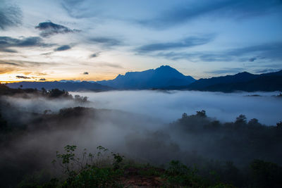 Scenic view of mountains against sky during sunset