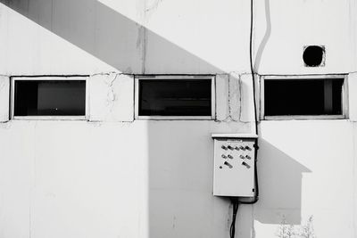 Full frame shot of white wall with windows