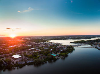 High angle view of calm river at sunset