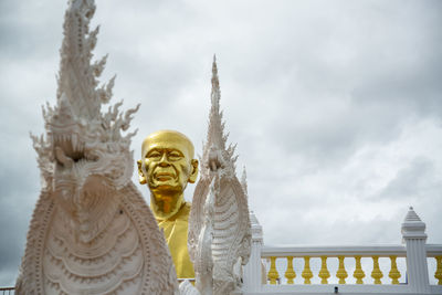 Low angle view of statue against sky