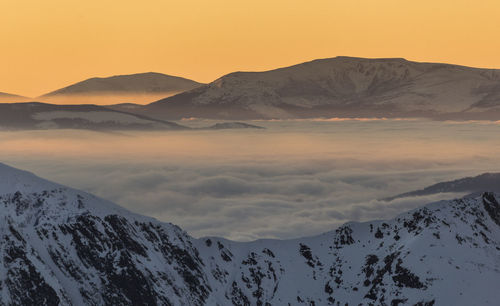 Scenic view of snowcapped mountains against sky during sunset, fagaras mountains