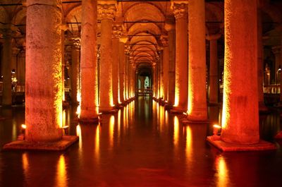 Illuminated corridor of historic building