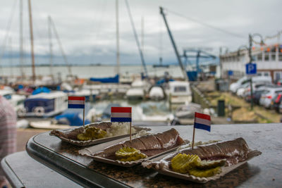 Close-up of foods with dutch flags in plates on table