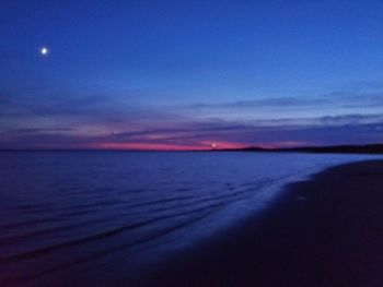 Scenic view of sea against sky at sunset