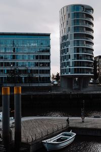 Modern buildings in city against sky