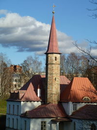 Tower amidst buildings against sky in city