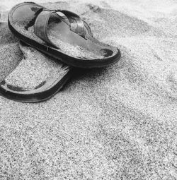 High angle view of shoes on rocky surface