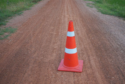 High angle view of traffic cone on dirt road