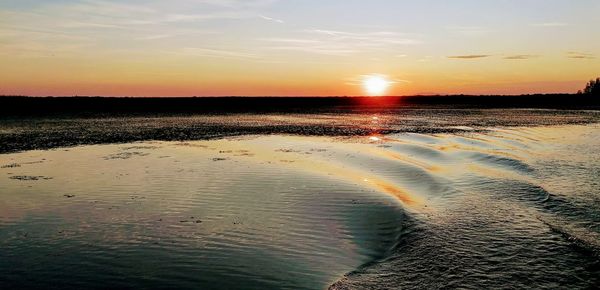 Scenic view of sea against sky during sunset