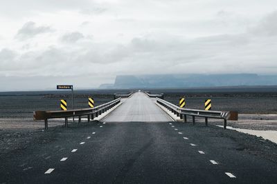 Scenic view of empty road in remote landscape