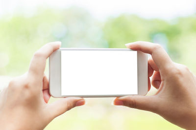 Midsection of man using mobile phone