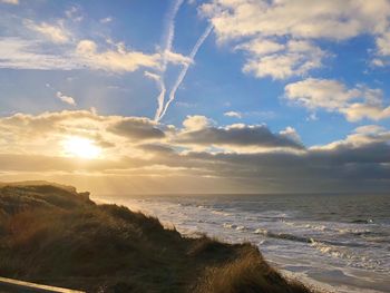 Scenic view of sea against sky during sunset