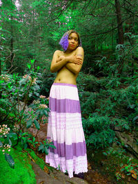 Portrait of young woman in forest