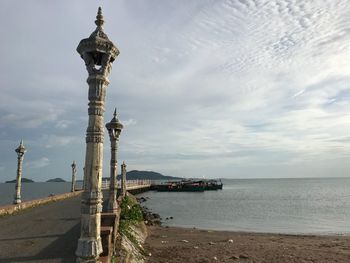 Scenic view of sea against cloudy sky