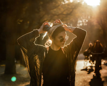 Midsection of woman standing outdoors