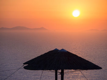 Scenic view of sea against orange sky