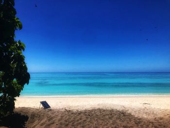 Scenic view of sea against clear blue sky