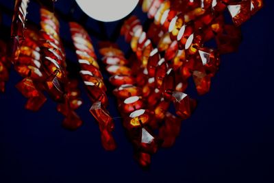 Illuminated chandelier against sky at dusk