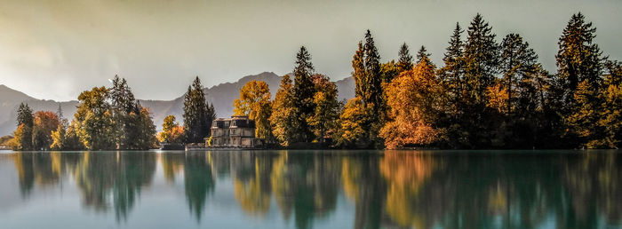 Scenic view of lake against sky during autumn