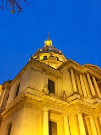 Low angle view of building against blue sky