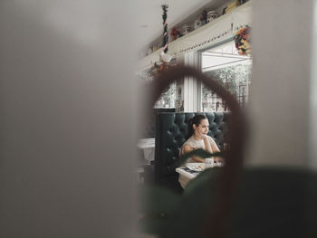 Portrait of smiling young woman using mobile phone