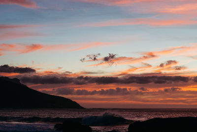 Scenic view of sea against sky at sunset