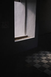 Window on tiled floor against wall at home