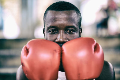 Portrait of man wearing boxing glove