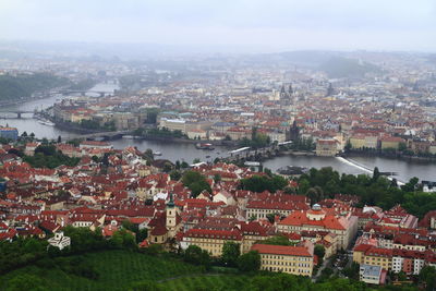 High angle view of river amidst buildings in town