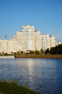 Buildings in city against clear sky