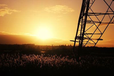 Silhouette landscape against sky during sunset