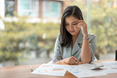 Businesswoman working at table