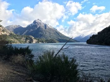 Scenic view of lake and mountains against sky