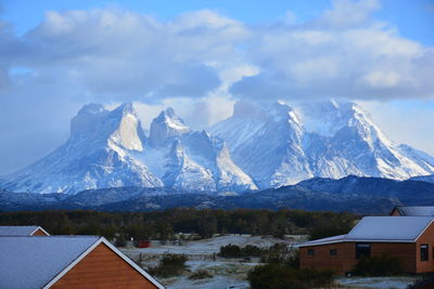 Houses on mountain against sky