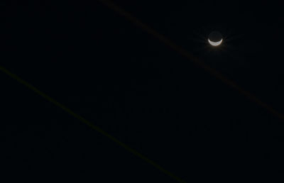 Low angle view of moon against sky at night