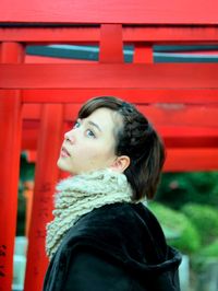 Portrait of young woman looking away outdoors