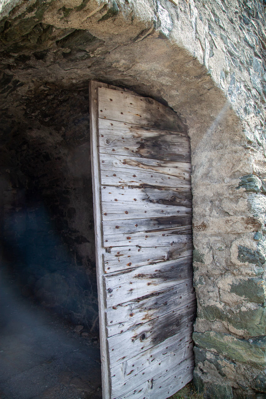 LOW ANGLE VIEW OF OLD WEATHERED WALL OF BUILDING