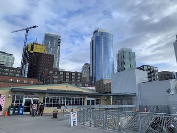 Modern buildings in city against sky