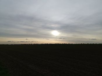 Scenic view of field against sky during sunset