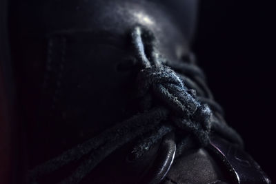 Close-up of rope tied up on metal