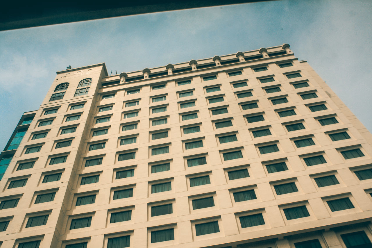 LOW ANGLE VIEW OF OFFICE BUILDING AGAINST SKY