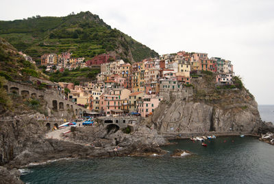 Calm sea with town in background